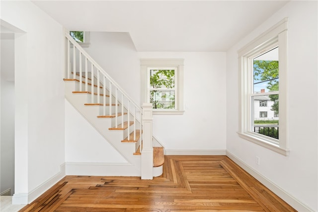 1314 Chalkstone Ave, Providence, RI 02908 - staircase with healthy amount of natural light and wood finished floors