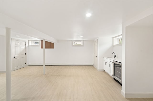 1314 Chalkstone Ave, Providence, RI 02908 - below grade area featuring beverage cooler, light wood-style flooring, recessed lighting, bar with sink, and healthy amount of natural light