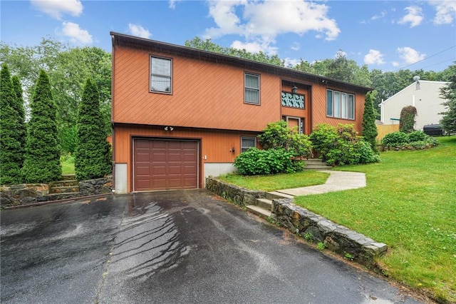 2 Birch St, Johnston, RI 02919 - view of front of home with a garage, driveway, and a front yard