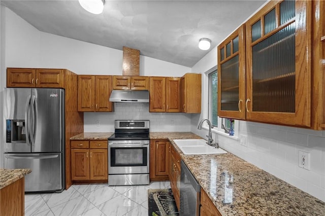 2 Birch St, Johnston, RI 02919 - kitchen featuring stainless steel appliances, under cabinet range hood, lofted ceiling, and brown cabinetry