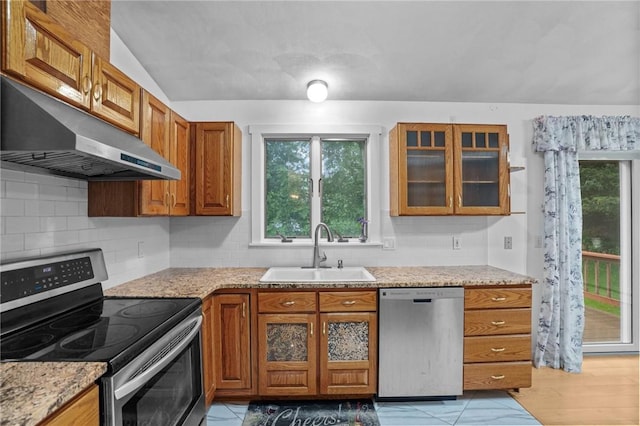 2 Birch St, Johnston, RI 02919 - kitchen with stainless steel appliances, under cabinet range hood, brown cabinets, decorative backsplash, and glass insert cabinets