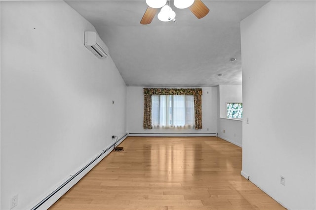 2 Birch St, Johnston, RI 02919 - empty room with a baseboard radiator, an AC wall unit, a ceiling fan, and wood finished floors