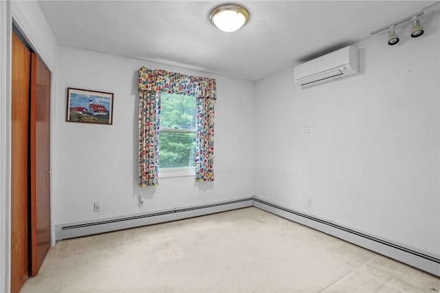 2 Birch St, Johnston, RI 02919 - empty room featuring a wall mounted air conditioner, a baseboard radiator, light colored carpet, and track lighting