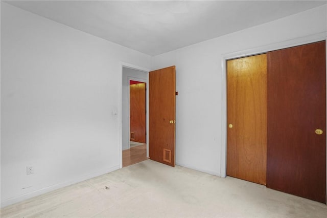 2 Birch St, Johnston, RI 02919 - unfurnished bedroom featuring a closet and carpet flooring