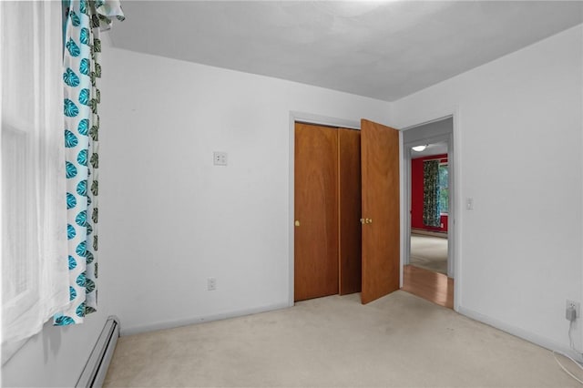 2 Birch St, Johnston, RI 02919 - unfurnished bedroom with carpet, a baseboard radiator, and a closet