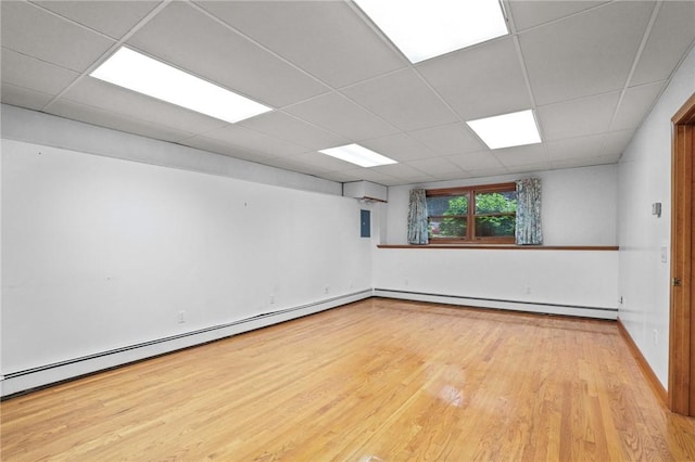 2 Birch St, Johnston, RI 02919 - spare room with a drop ceiling, wood finished floors, baseboard heating, and a baseboard heating unit