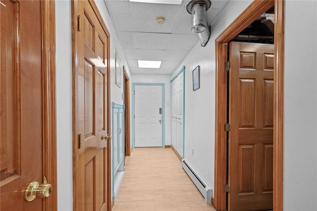 2 Birch St, Johnston, RI 02919 - hallway featuring baseboard heating, light wood-style floors, and a paneled ceiling