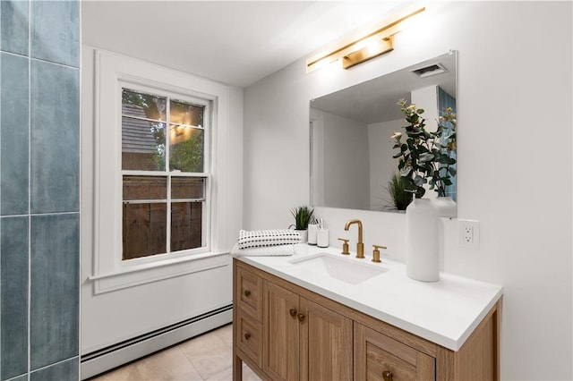 51 Poplar St Unit 1L, Newport, RI 02840 - bathroom with baseboard heating, vanity, and tile patterned floors