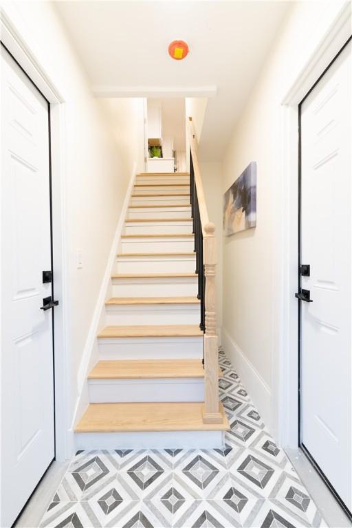 51 Poplar St Unit 1L, Newport, RI 02840 - stairway featuring baseboards