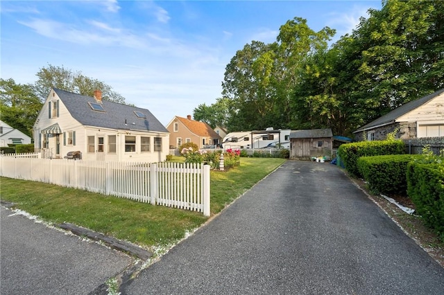 3 Arrow Ave, Warwick, RI 02886 - bungalow with a residential view, driveway, and a chimney