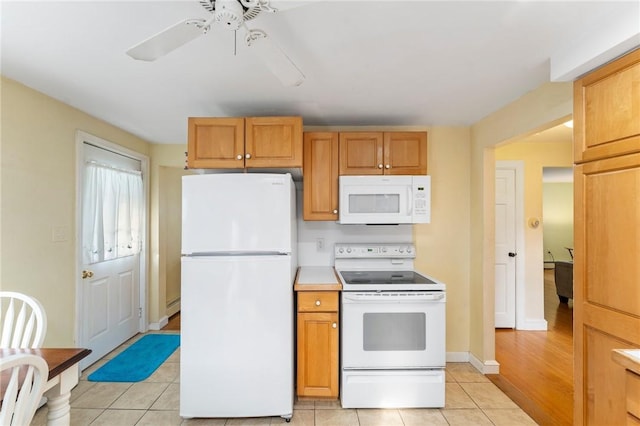 3 Arrow Ave, Warwick, RI 02886 - kitchen with white appliances, light tile patterned floors, ceiling fan, light countertops, and baseboard heating