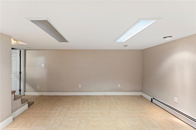 3 Arrow Ave, Warwick, RI 02886 - empty room featuring a baseboard heating unit and stairs