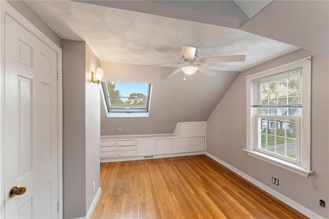 3 Arrow Ave, Warwick, RI 02886 - bonus room with light wood-style floors, a skylight, vaulted ceiling, plenty of natural light, and ceiling fan