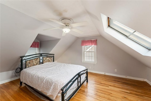 3 Arrow Ave, Warwick, RI 02886 - bedroom featuring a skylight, light wood finished floors, lofted ceiling, and a ceiling fan