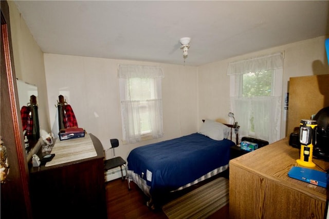 66 Beach St, Warren, RI 02885 - bedroom with multiple windows, a baseboard radiator, and dark wood-style flooring