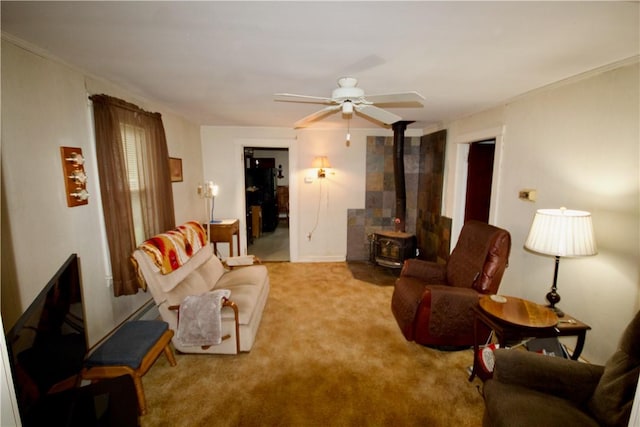 66 Beach St, Warren, RI 02885 - carpeted living room featuring a wood stove and ceiling fan