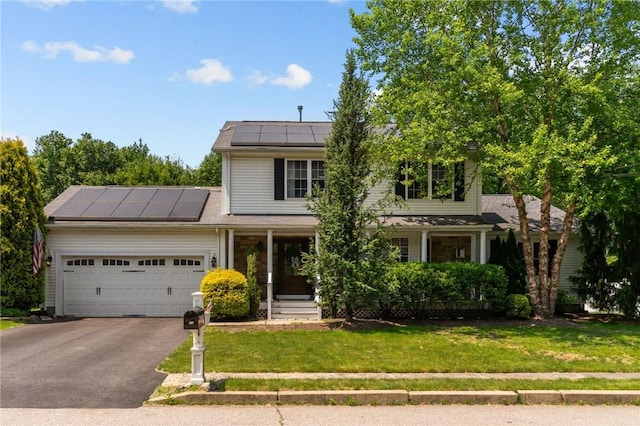11 Celebration Way, Johnston, RI 02919 - traditional-style home featuring roof mounted solar panels, a porch, driveway, a front lawn, and a garage