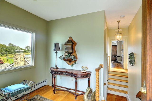 8 Alger Ave, Warwick, RI 02818 - corridor featuring wood finished floors and baseboard heating