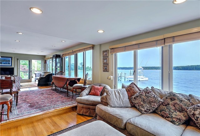 8 Alger Ave, Warwick, RI 02818 - living room featuring recessed lighting, a water view, and wood finished floors