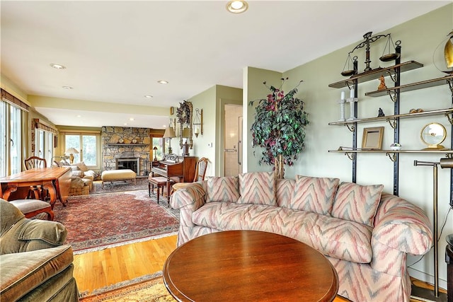 8 Alger Ave, Warwick, RI 02818 - living area featuring wood finished floors, a stone fireplace, and recessed lighting