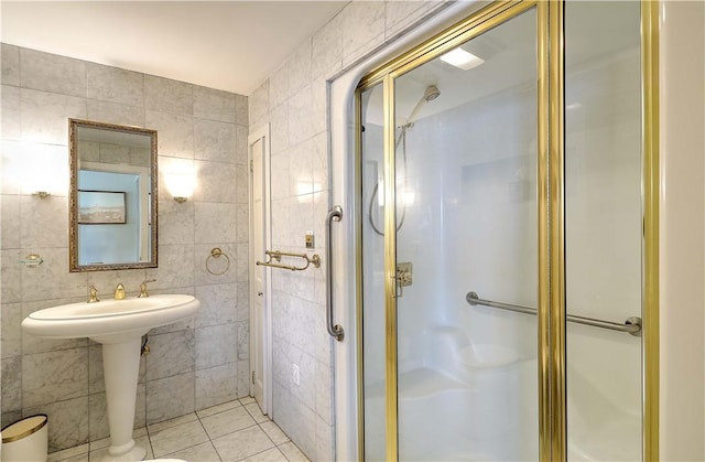 8 Alger Ave, Warwick, RI 02818 - bathroom featuring tile walls, a shower stall, and tile patterned floors