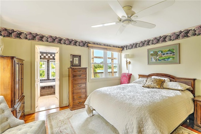 8 Alger Ave, Warwick, RI 02818 - bedroom with light wood-style floors, ceiling fan, and connected bathroom