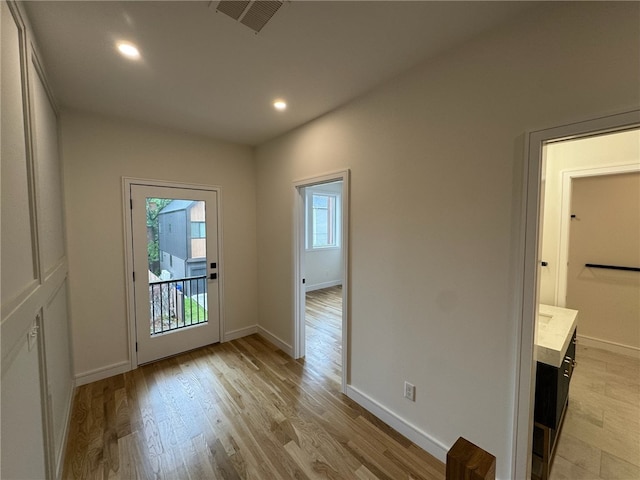 12 Daggett Ct Unit 2, Providence, RI 02906 - doorway to outside featuring light wood-type flooring and recessed lighting