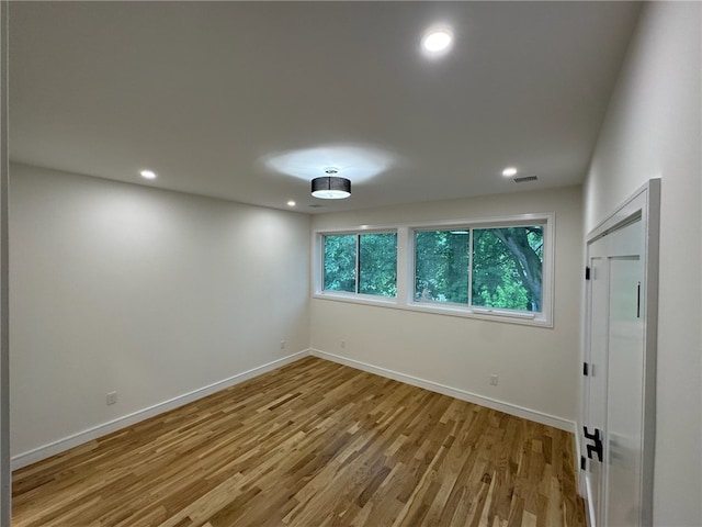 12 Daggett Ct Unit 2, Providence, RI 02906 - empty room with wood finished floors and recessed lighting