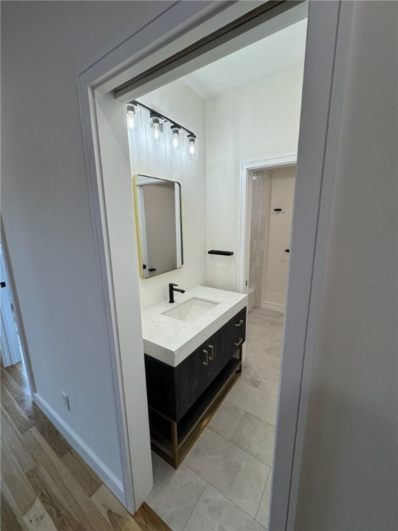 12 Daggett Ct Unit 2, Providence, RI 02906 - bathroom featuring vanity and baseboards