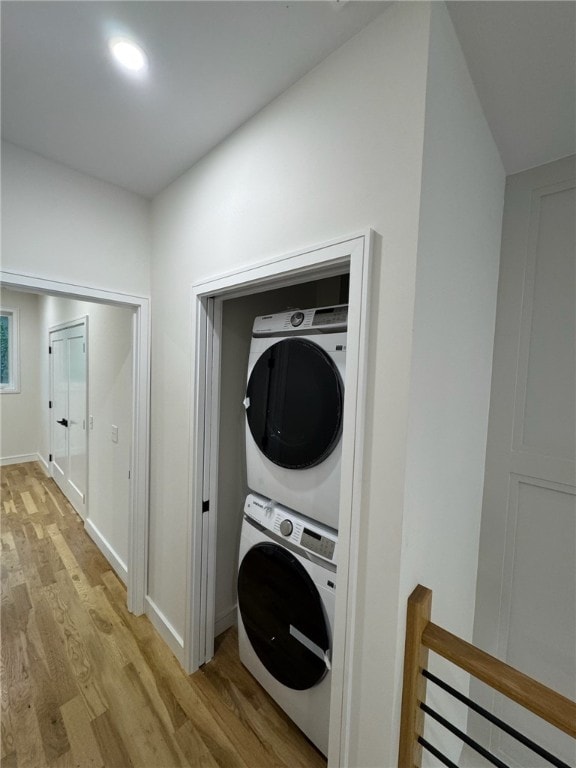 12 Daggett Ct Unit 2, Providence, RI 02906 - washroom featuring estacked washer and dryer and light wood-style floors