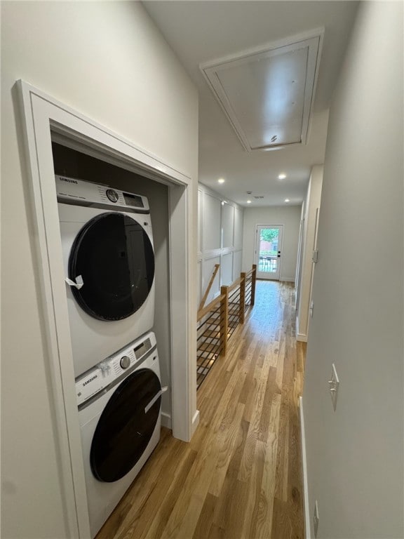 12 Daggett Ct Unit 2, Providence, RI 02906 - laundry room featuring attic access, estacked washer and dryer, light wood-style floors, and recessed lighting