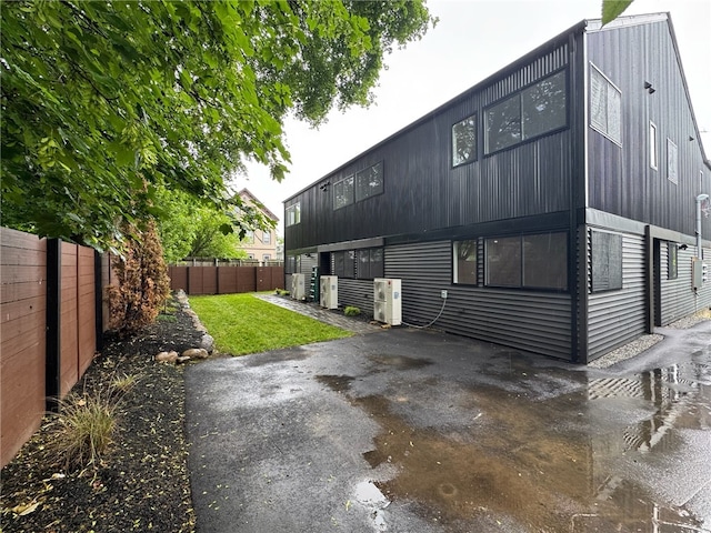 12 Daggett Ct Unit 2, Providence, RI 02906 - rear view of property featuring a fenced backyard and a patio
