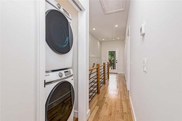12 Daggett Ct Unit 2, Providence, RI 02906 - laundry area with attic access, stacked washing machine and dryer, light wood-type flooring, and recessed lighting