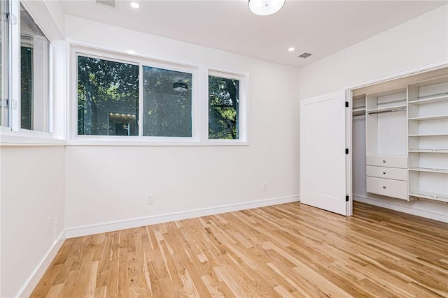 12 Daggett Ct Unit 2, Providence, RI 02906 - unfurnished bedroom with light wood-style floors and recessed lighting