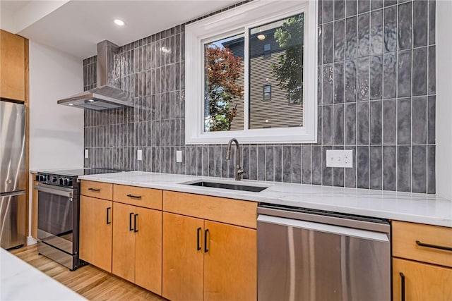 12 Daggett Ct Unit 2, Providence, RI 02906 - kitchen featuring stainless steel appliances, wall chimney exhaust hood, tasteful backsplash, healthy amount of natural light, and recessed lighting