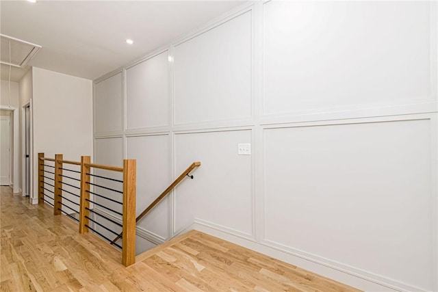 12 Daggett Ct Unit 2, Providence, RI 02906 - stairway with attic access, wood finished floors, a decorative wall, and recessed lighting