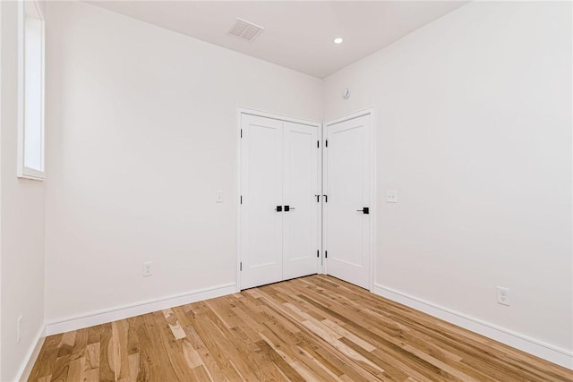 12 Daggett Ct Unit 2, Providence, RI 02906 - spare room with light wood-style flooring and baseboards