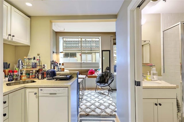 65 Weybosset St Unit 202, Providence, RI 02903 - kitchen with white dishwasher, white cabinetry, and light countertops