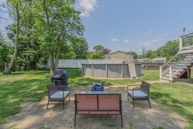 136 Youngs Ave, Coventry, RI 02816 - fenced backyard with a grill and stairs