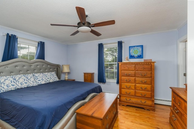 136 Youngs Ave, Coventry, RI 02816 - bedroom featuring light wood-type flooring, multiple windows, crown molding, a baseboard radiator, and a textured ceiling