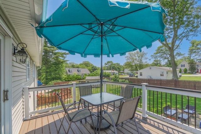 136 Youngs Ave, Coventry, RI 02816 - wooden terrace with outdoor dining space and a residential view