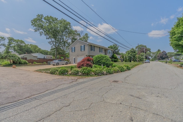 136 Youngs Ave, Coventry, RI 02816 - view of front of property with a garage and asphalt driveway