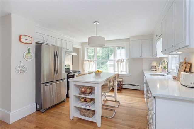 280 S Pierce Rd, East Greenwich, RI 02818 - kitchen with appliances with stainless steel finishes, white cabinets, light countertops, open shelves, and light wood-type flooring