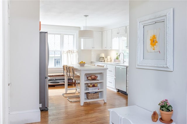 280 S Pierce Rd, East Greenwich, RI 02818 - kitchen with appliances with stainless steel finishes, white cabinetry, light countertops, and open shelves