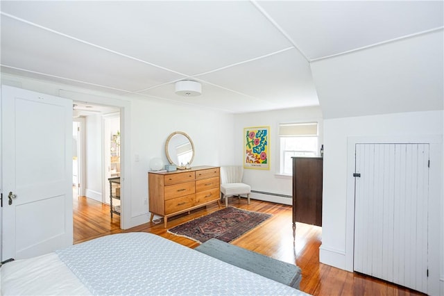 280 S Pierce Rd, East Greenwich, RI 02818 - bedroom featuring a baseboard heating unit and wood finished floors