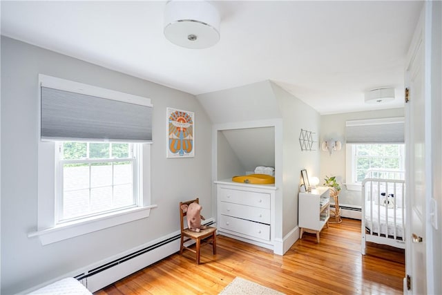 280 S Pierce Rd, East Greenwich, RI 02818 - bedroom featuring a baseboard radiator, light wood-style floors, and vaulted ceiling