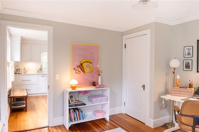 280 S Pierce Rd, East Greenwich, RI 02818 - bedroom with light wood finished floors, crown molding, and a desk