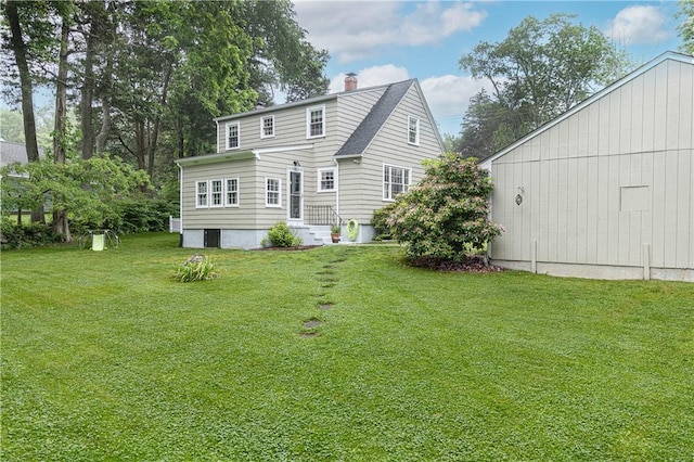 280 S Pierce Rd, East Greenwich, RI 02818 - back of property featuring a chimney and a lawn