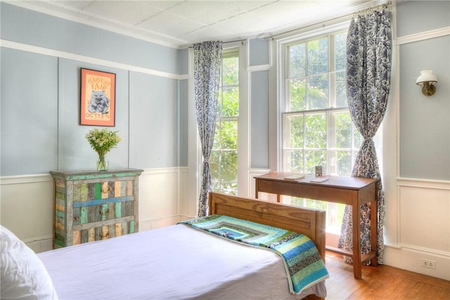 24 Old Beach Rd, Newport, RI 02840 - bedroom featuring a decorative wall, wainscoting, and wood finished floors