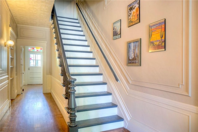 24 Old Beach Rd, Newport, RI 02840 - stairs with a decorative wall and wood finished floors
